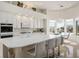 Bright kitchen with white cabinetry, sleek countertops, and stainless steel appliances, perfect for cooking and entertaining at 11037 Clarion Ln, Las Vegas, NV 89134