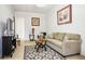 Comfortable living room with a decorative rug, cozy seating, and natural light, perfect for a relaxing retreat at 11037 Clarion Ln, Las Vegas, NV 89134
