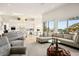 Open-concept living area with kitchen view and seamless flow to the backyard's pool and lush landscaping at 11037 Clarion Ln, Las Vegas, NV 89134