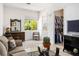 Bright living room with natural light, tile flooring, and comfortable seating, perfect for relaxation and entertaining at 11037 Clarion Ln, Las Vegas, NV 89134