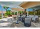 Covered patio includes outdoor furniture, built in bar area, and desert landscaping at 11037 Clarion Ln, Las Vegas, NV 89134