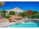 Backyard pool includes bridge feature and rock details at 11037 Clarion Ln, Las Vegas, NV 89134