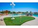 Backyard pool area with a golf putting green and lush garden at 11037 Clarion Ln, Las Vegas, NV 89134