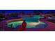 Custom swimming pool with rock features, waterfall, and serene ambiance for luxurious outdoor living at 11037 Clarion Ln, Las Vegas, NV 89134