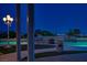 View of a custom swimming pool with a putting green and city views, perfect for outdoor leisure and entertainment at 11037 Clarion Ln, Las Vegas, NV 89134