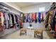 Organized walk-in closet with ample hanging space, shelving, and natural light, perfect for wardrobe management at 11037 Clarion Ln, Las Vegas, NV 89134
