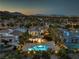 Aerial view of a luxury home featuring a pool, patio, and lush landscaping at 11573 Glowing Sunset Ln, Las Vegas, NV 89135