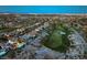 Expansive aerial home view with mountains and golf course, creating a luxurious landscape at 11573 Glowing Sunset Ln, Las Vegas, NV 89135
