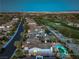 Stunning aerial home view with lush golf course backdrop and city skyline at 11573 Glowing Sunset Ln, Las Vegas, NV 89135