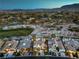Aerial view of a luxury home nestled among lush greenery and scenic mountain views at 11573 Glowing Sunset Ln, Las Vegas, NV 89135