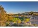 Backyard view showing a golf course, neighborhood, and trees at 11573 Glowing Sunset Ln, Las Vegas, NV 89135