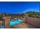 Balcony view of the sparkling pool and lush desert landscape, offering a private outdoor oasis at 11573 Glowing Sunset Ln, Las Vegas, NV 89135