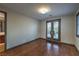 Bedroom featuring hardwood floors and doors leading to a balcony at 11573 Glowing Sunset Ln, Las Vegas, NV 89135