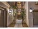 Charming front entrance with a wrought-iron gate and manicured landscaping at 11573 Glowing Sunset Ln, Las Vegas, NV 89135