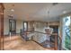 Upstairs landing with decorative chandelier, custom ironwork, and views to the backyard at 11573 Glowing Sunset Ln, Las Vegas, NV 89135