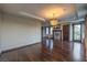 Spacious living room with hardwood floors, fireplace, and access to an outdoor balcony at 11573 Glowing Sunset Ln, Las Vegas, NV 89135