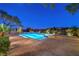 Backyard features a beautiful pool with desert and mountain views at 11573 Glowing Sunset Ln, Las Vegas, NV 89135