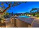 Outdoor kitchen and built in bbq next to a beautiful pool at 11573 Glowing Sunset Ln, Las Vegas, NV 89135