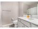 Bright bathroom features white countertops, a sleek vanity, modern fixtures, and a shower with curtain at 11870 Tevare Ln # 1085, Las Vegas, NV 89138