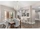 Bright dining area adjacent to the kitchen, illuminated by a chandelier at 11870 Tevare Ln # 1085, Las Vegas, NV 89138
