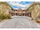Beautiful desert landscaping frames this stylish home's courtyard and garage entries at 11870 Tevare Ln # 1085, Las Vegas, NV 89138