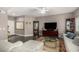 Comfortable living room with wood floors, a white sofa, and media center at 11870 Tevare Ln # 1085, Las Vegas, NV 89138