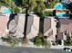 Beautiful suburban home with a tile roof, mature trees, and sparkling swimming pools at 1348 Calle Montery St, Las Vegas, NV 89117