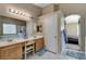 Bathroom featuring dual sinks, white countertops, tile floor, and recessed lighting at 1348 Calle Montery St, Las Vegas, NV 89117