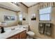 Cozy bathroom featuring a large mirror, neutral tones, and ample lighting at 1348 Calle Montery St, Las Vegas, NV 89117