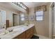 Bright bathroom with dual sinks, framed mirrors and natural light at 1348 Calle Montery St, Las Vegas, NV 89117