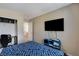 Comfortable bedroom featuring a flat screen TV, natural light, and a closet at 1348 Calle Montery St, Las Vegas, NV 89117