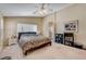 Cozy bedroom with neutral walls, plush carpet, and an ensuite bathroom at 1348 Calle Montery St, Las Vegas, NV 89117