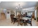 Traditional dining room boasts a chandelier, mirror wall, and wood flooring at 1348 Calle Montery St, Las Vegas, NV 89117
