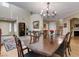 Elegant dining room features a chandelier, large table, and high ceilings at 1348 Calle Montery St, Las Vegas, NV 89117