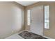 Cozy entryway featuring a white door, tile flooring, and natural light from sidelight windows at 1348 Calle Montery St, Las Vegas, NV 89117
