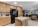 Inviting kitchen featuring an island and light wood cabinets for a bright and airy feel at 1348 Calle Montery St, Las Vegas, NV 89117