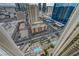 High-rise view capturing a lively city with rooftop pools, surrounding buildings, and active streets at 135 E Harmon Ave # 3215, Las Vegas, NV 89109