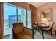 Comfortable seating area with table, chairs, and large windows offering panoramic city views at 135 E Harmon Ave # 3215, Las Vegas, NV 89109