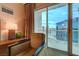Cozy living space with an arm chair, table lamp, and large windows offering beautiful city views at 135 E Harmon Ave # 3215, Las Vegas, NV 89109