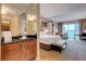 Luxurious bedroom with a king bed, entertainment area and kitchenette at 135 E Harmon Ave # 3215, Las Vegas, NV 89109
