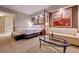 The bedroom features a king bed, a sofa, and modern lighting, creating a warm and inviting space at 135 E Harmon Ave # 3215, Las Vegas, NV 89109