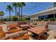 Comfortable outdoor lounge area with sofas, chairs, and stylish decor at 135 E Harmon Ave # 3215, Las Vegas, NV 89109