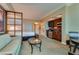 This bedroom features a bed, seating area, and partial kitchen at 145 E Harmon Ave # 3103, Las Vegas, NV 89109