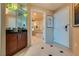 Hallway featuring marble floors and a wet bar leading to the bathroom at 145 E Harmon Ave # 3103, Las Vegas, NV 89109