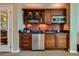 Kitchenette with granite countertops, mini fridge, microwave and stainless-steel sink at 145 E Harmon Ave # 3103, Las Vegas, NV 89109