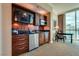 Kitchenette with granite countertops, mini fridge, microwave and stainless-steel sink at 145 E Harmon Ave # 3103, Las Vegas, NV 89109