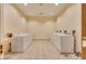 Clean laundry room with multiple washing machines and dryers for residents' convenience at 145 E Harmon Ave # 3103, Las Vegas, NV 89109