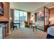 Relaxing living room area with comfortable seating, a table, and great city views at 145 E Harmon Ave # 3103, Las Vegas, NV 89109