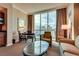 Comfortable living room features floor to ceiling window offering city views at 145 E Harmon Ave # 3103, Las Vegas, NV 89109