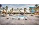 Refreshing pool surrounded by palm trees and lounge chairs for a resort-like experience at 145 E Harmon Ave # 3103, Las Vegas, NV 89109